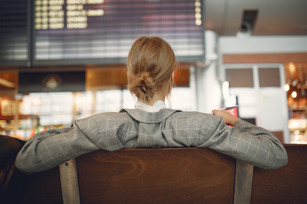 Young woman waiting at an airport