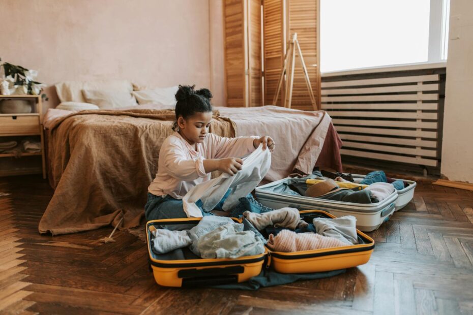 Young girl packing her suitcase
